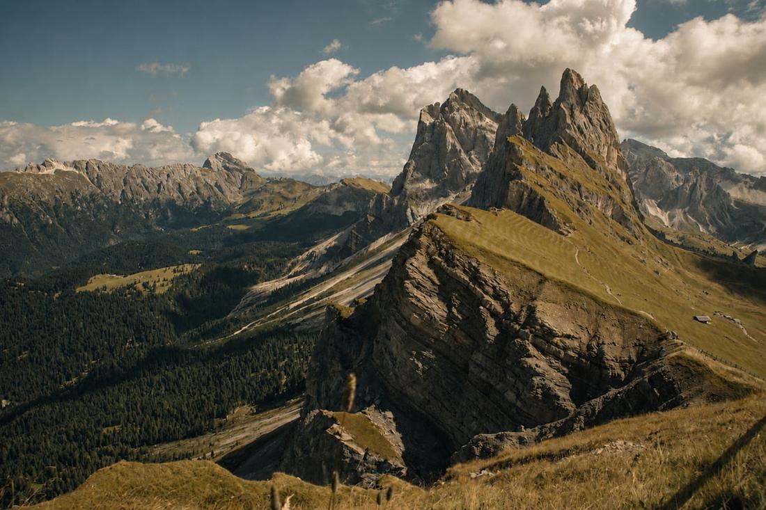 Jagged limestone peaks rising above a green valley